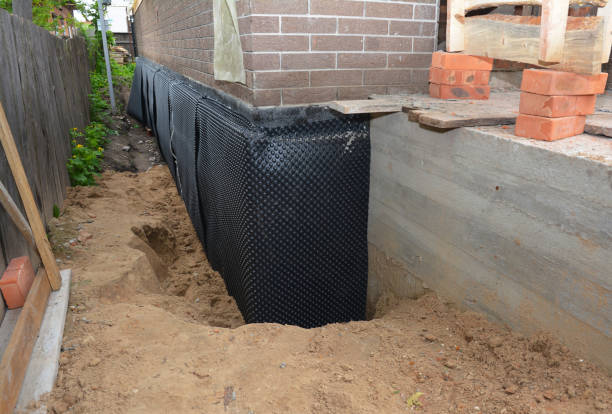 Happy homeowners after waterproofing job in Straughn